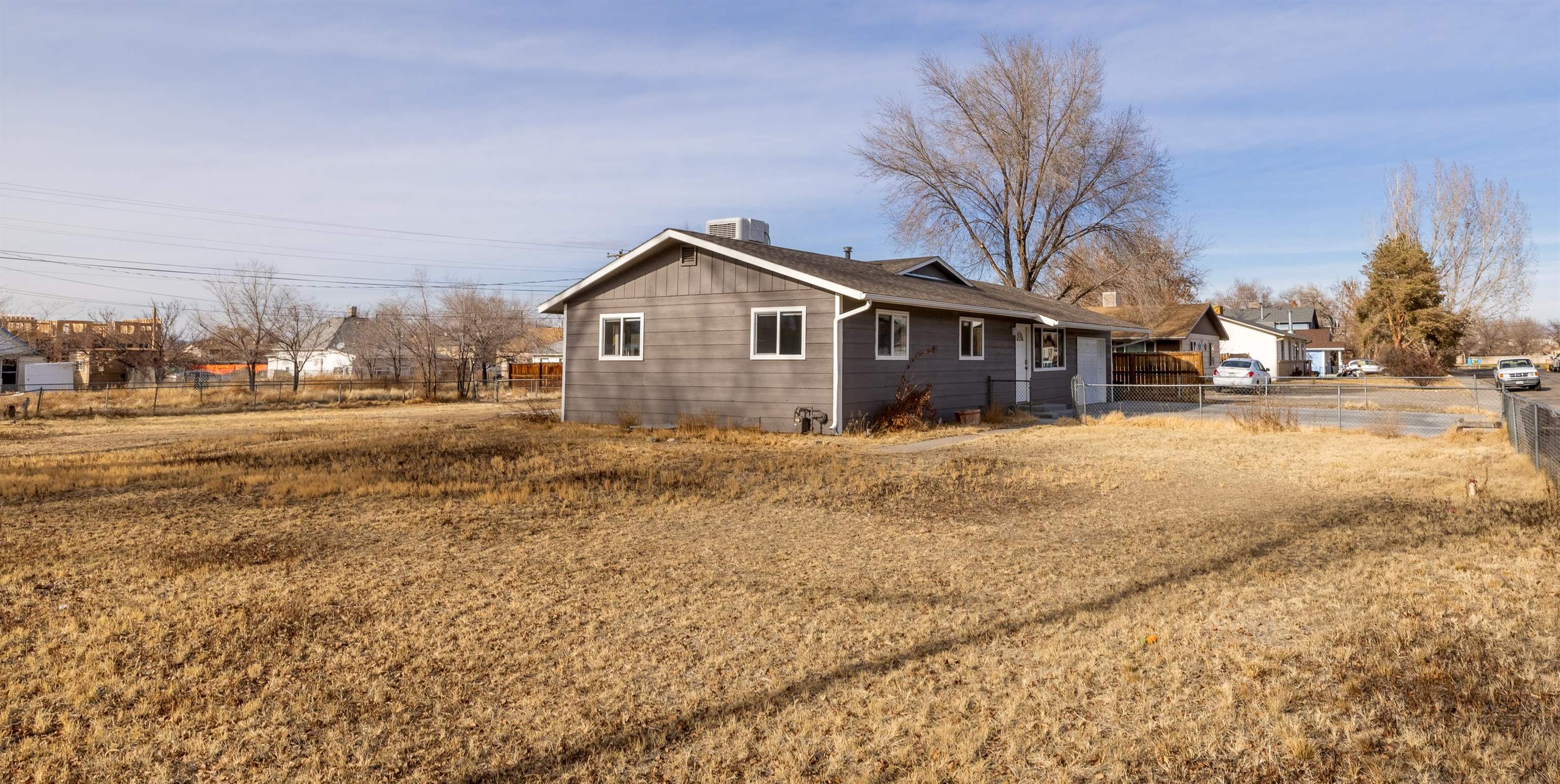 137 North Willow Street Fruita, CO 81521 - Photo 27 of 27 a view of a large house with a yard