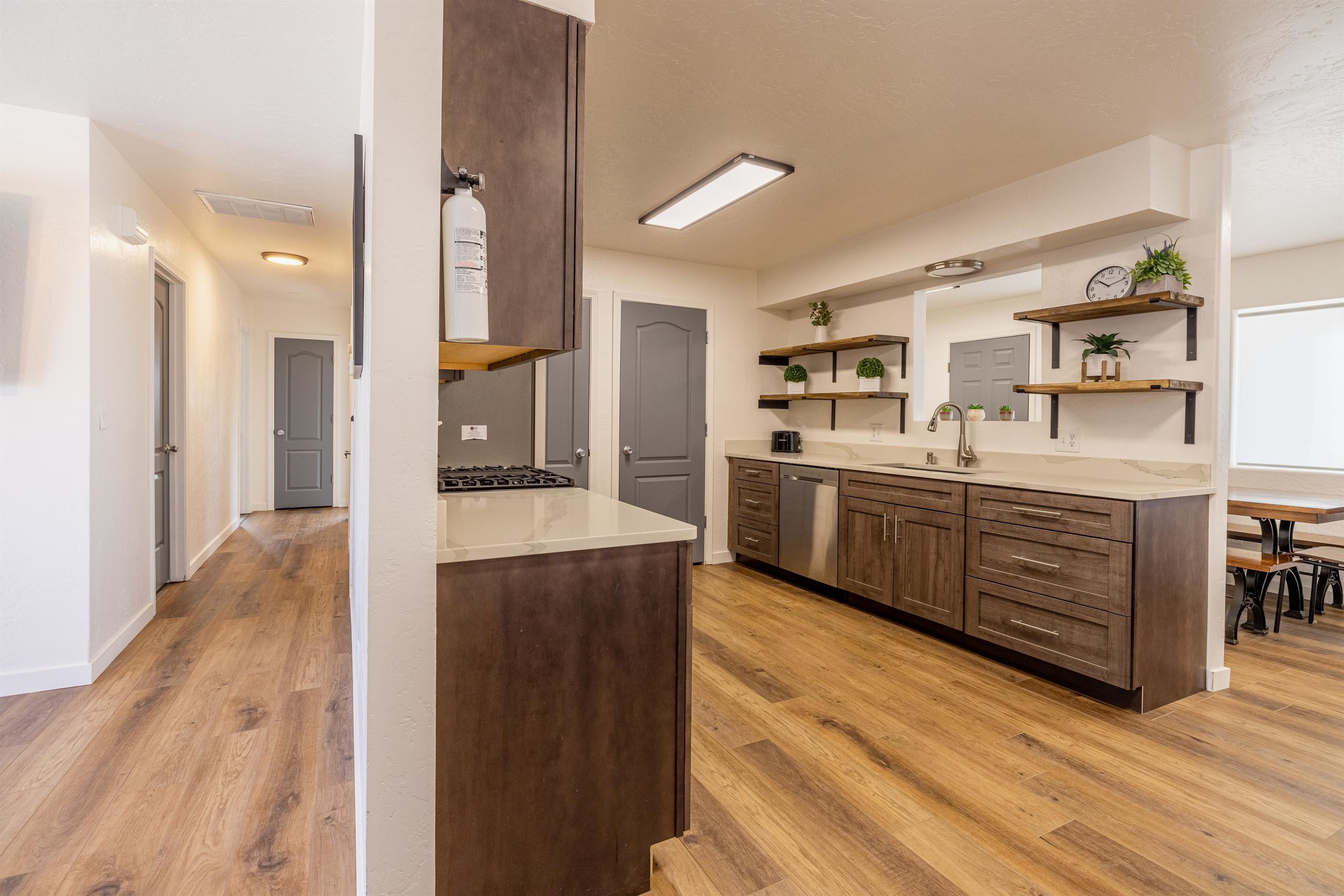 137 North Willow Street Fruita, CO 81521 - Photo 3 of 27 a kitchen with stainless steel appliances a sink and wooden floor
