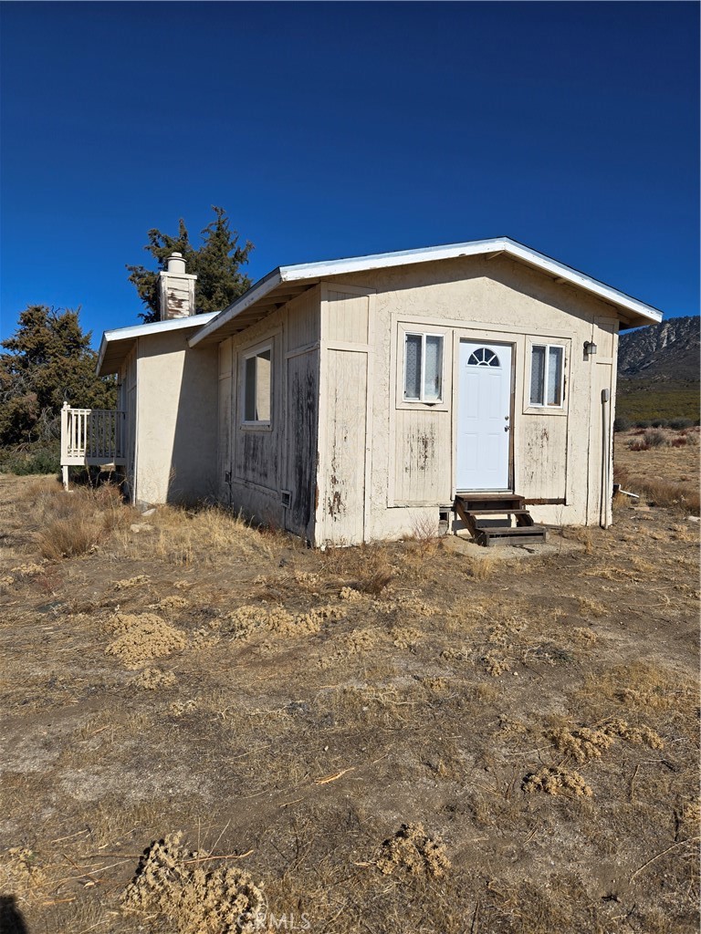36650 Bautista Road Anza, CA 92539 - Photo 14 of 16 a front view of a house with a yard