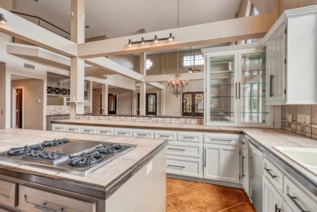 a kitchen with a stove and a sink
