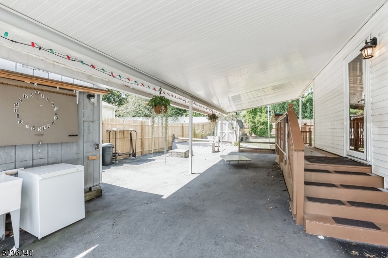 13 Wayne Boulevard Madison, NJ 07940 - Photo 13 of 15 a view of a patio with table and chairs