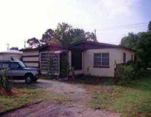2494 Southeast Washington Street Stuart, FL 34997 - Photo 1 of 1 a view of a house with a backyard