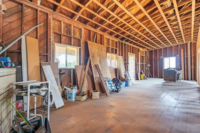 a view of an entryway with wooden floor