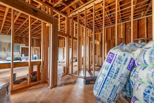 a view of an empty room with floor to ceiling window