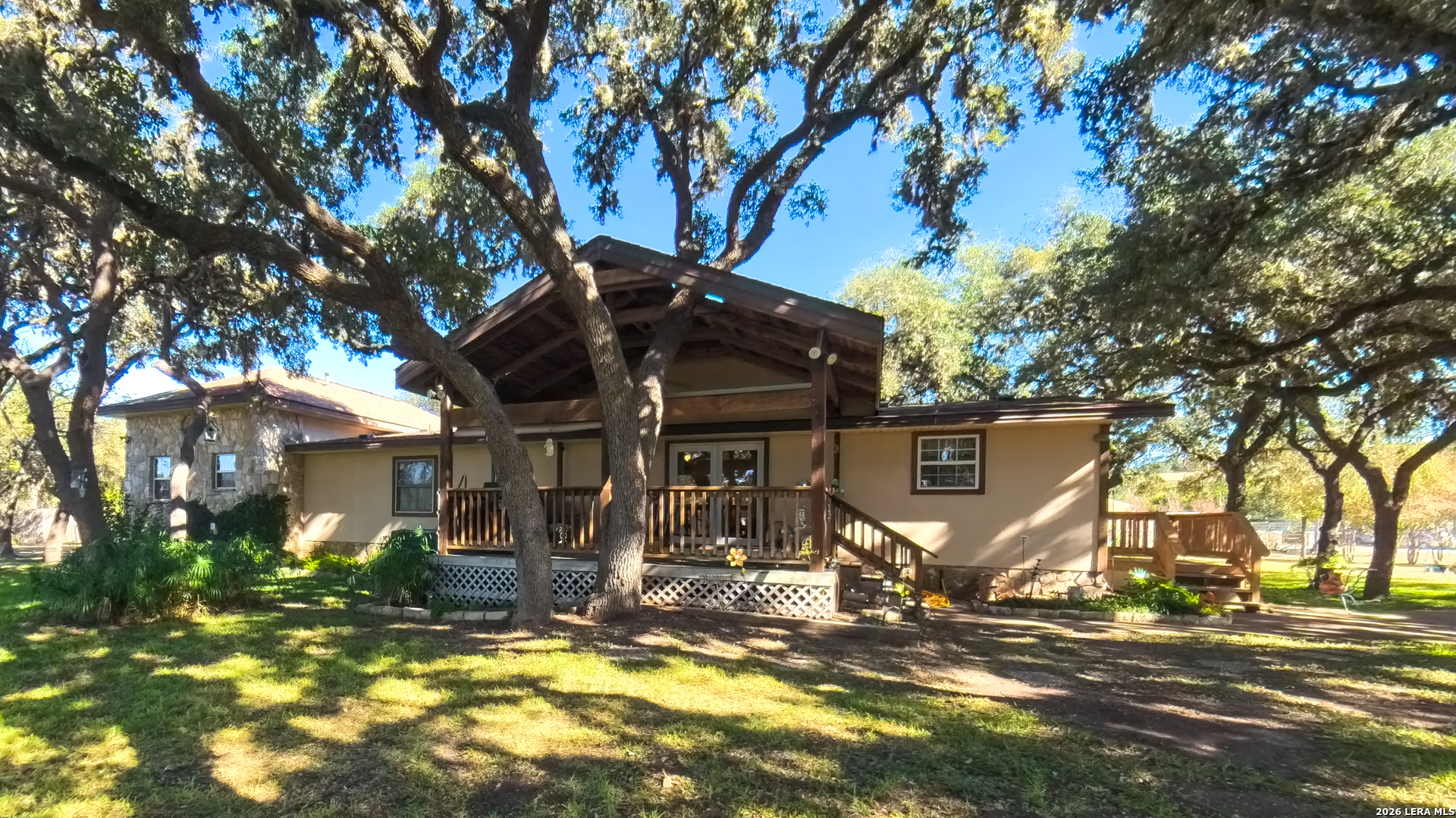 857 Madrona Road Pipe Creek, TX 78063 - Photo 1 of 49 a view of a house with large tree