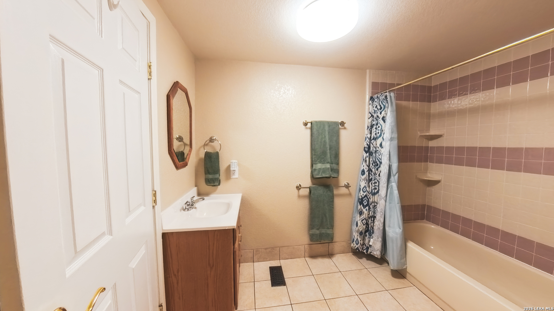 857 Madrona Road Pipe Creek, TX 78063 - Photo 21 of 49 a bathroom with a sink and a mirror