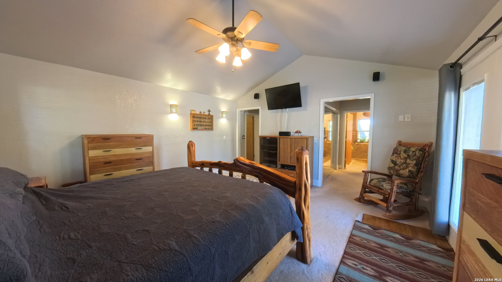 857 Madrona Road Pipe Creek, TX 78063 - Photo 25 of 49 a bed room with a bed and a tv