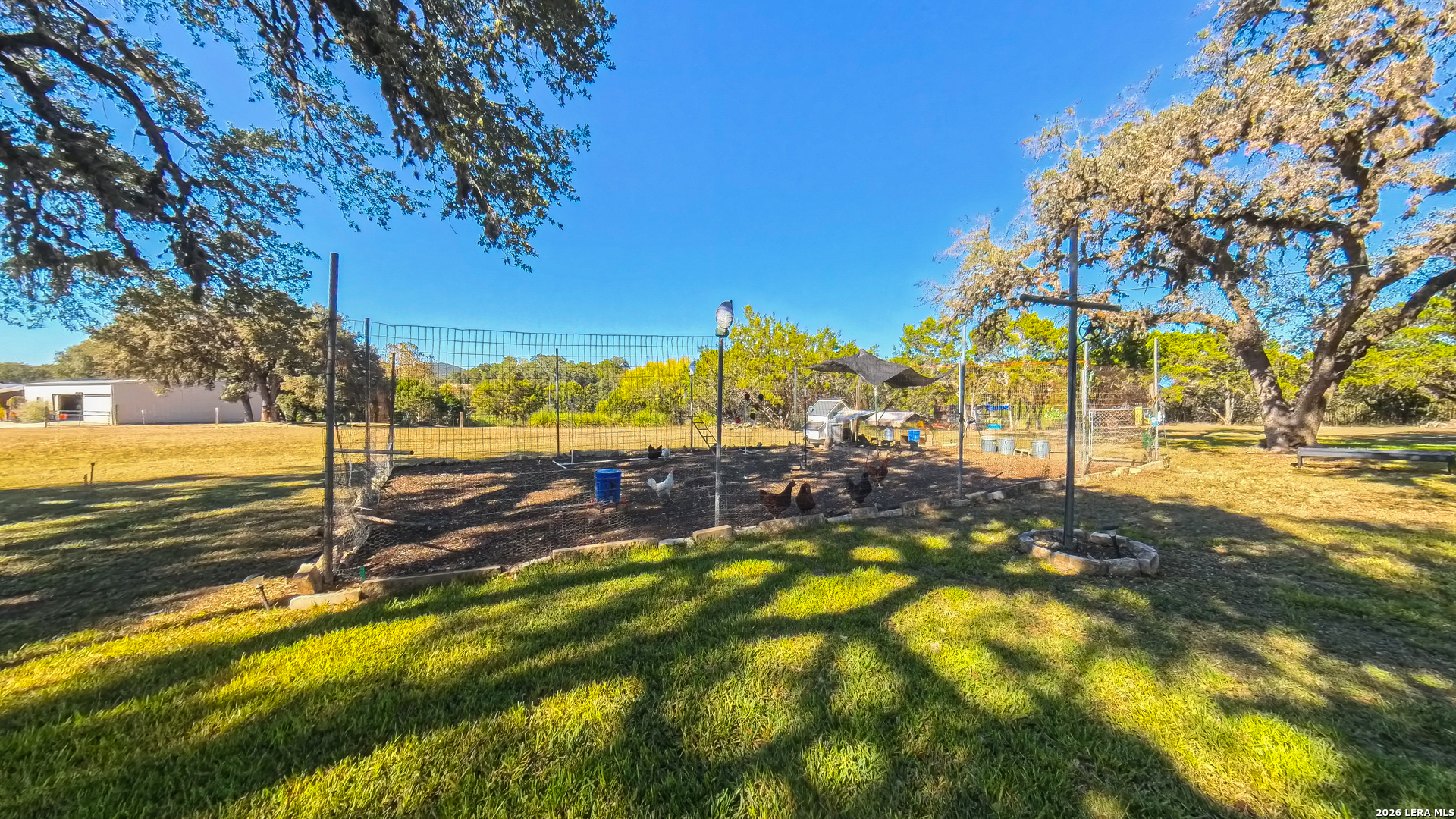 857 Madrona Road Pipe Creek, TX 78063 - Photo 30 of 49 a view of a yard with swimming pool and sitting area