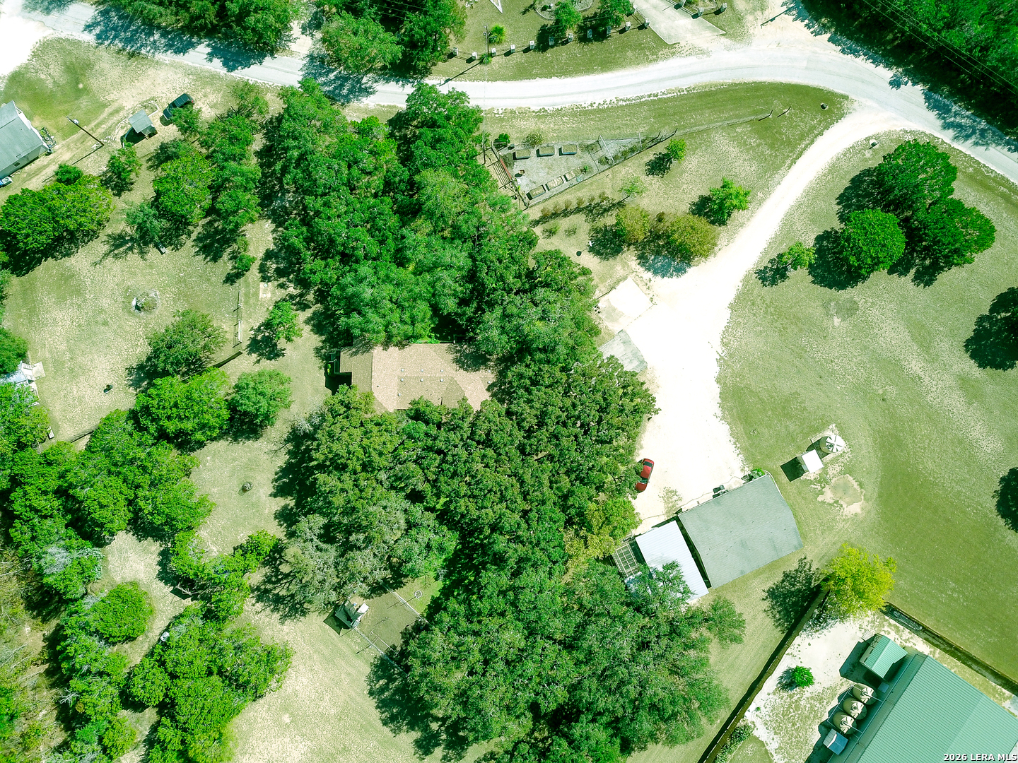 857 Madrona Road Pipe Creek, TX 78063 - Photo 3 of 49 an aerial view of residential house with outdoor space and trees all around