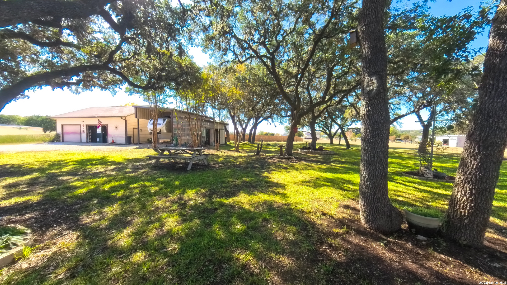 857 Madrona Road Pipe Creek, TX 78063 - Photo 33 of 49 a view of a swimming pool with a patio and a yard