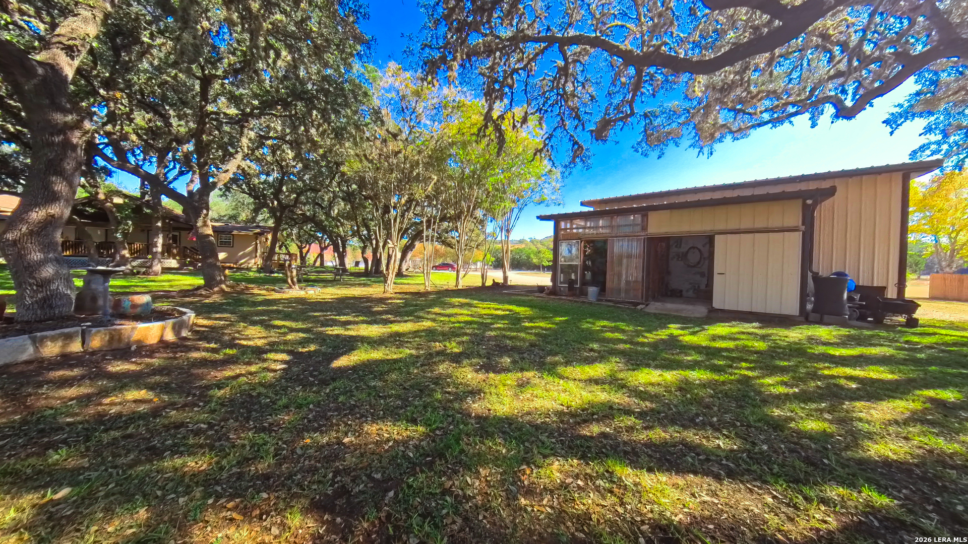 857 Madrona Road Pipe Creek, TX 78063 - Photo 34 of 49 a view of a house with a yard