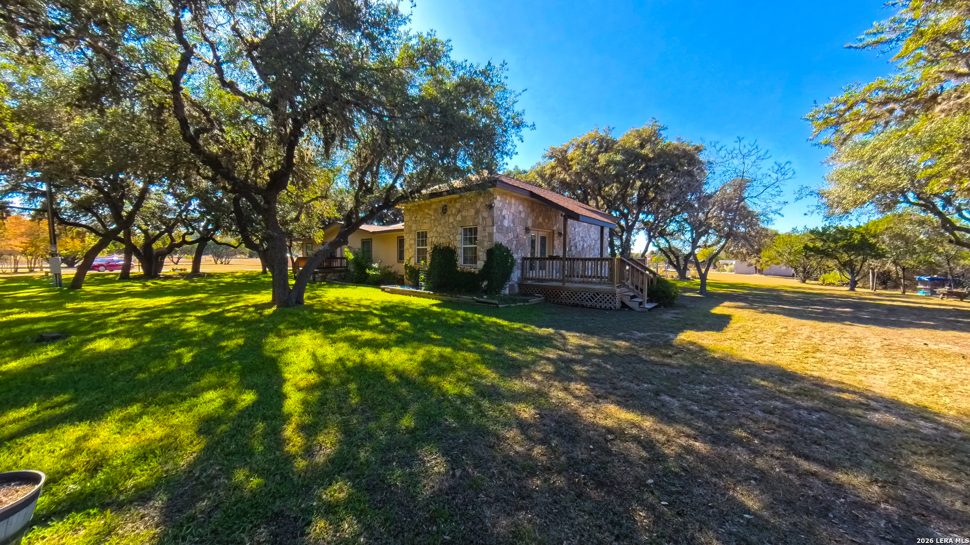 857 Madrona Road Pipe Creek, TX 78063 - Photo 45 of 49 a view of a house with a yard