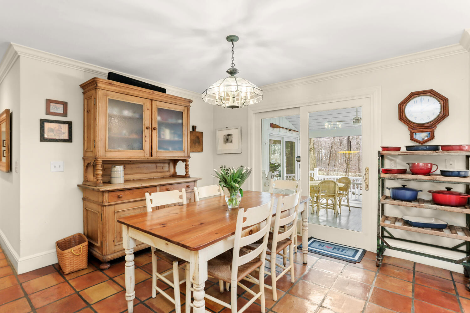 215 Marvin Ridge Road New Canaan, CT 06840 - Photo 11 of 31 a dining room with wooden floor and chandelier