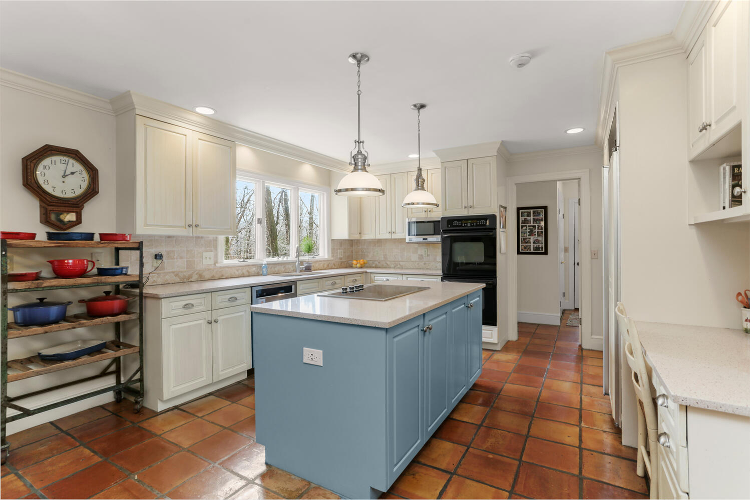215 Marvin Ridge Road New Canaan, CT 06840 - Photo 12 of 31 a kitchen with a sink stove and cabinets