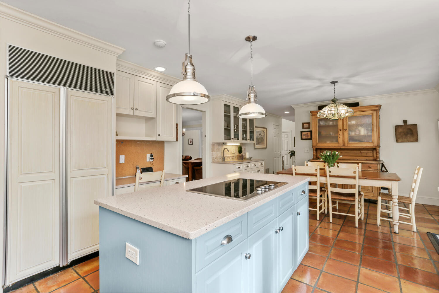 215 Marvin Ridge Road New Canaan, CT 06840 - Photo 13 of 31 a kitchen that has a lot of cabinets a sink a dining table and chairs