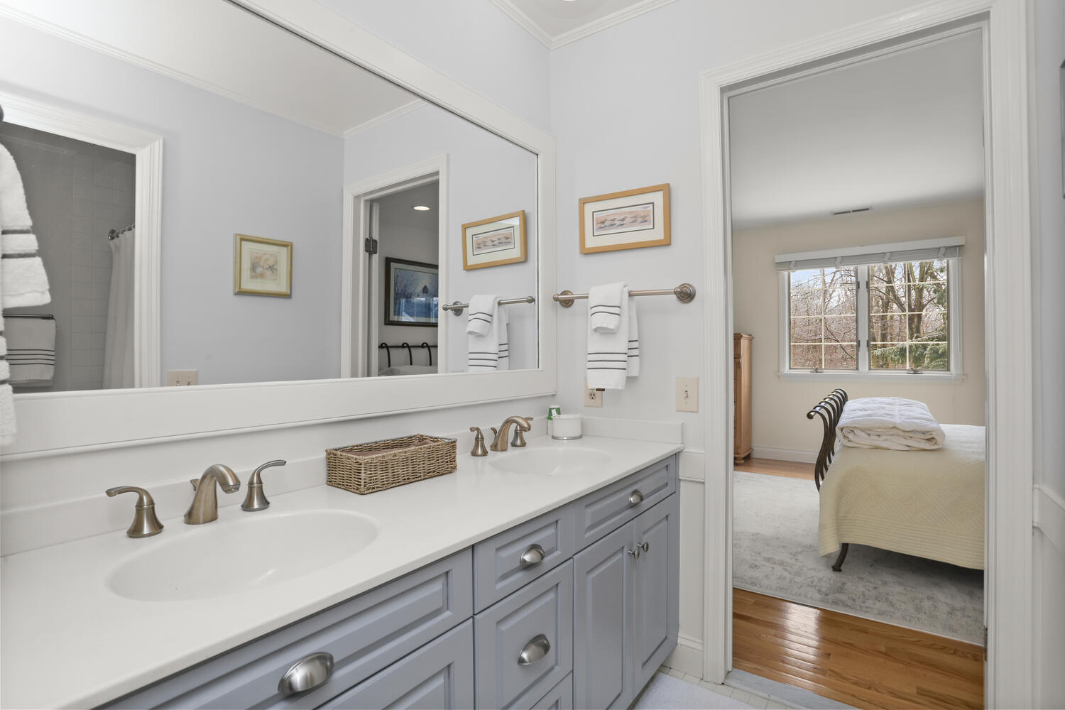 215 Marvin Ridge Road New Canaan, CT 06840 - Photo 22 of 31 a en suite bathroom with double vanity and a mirror