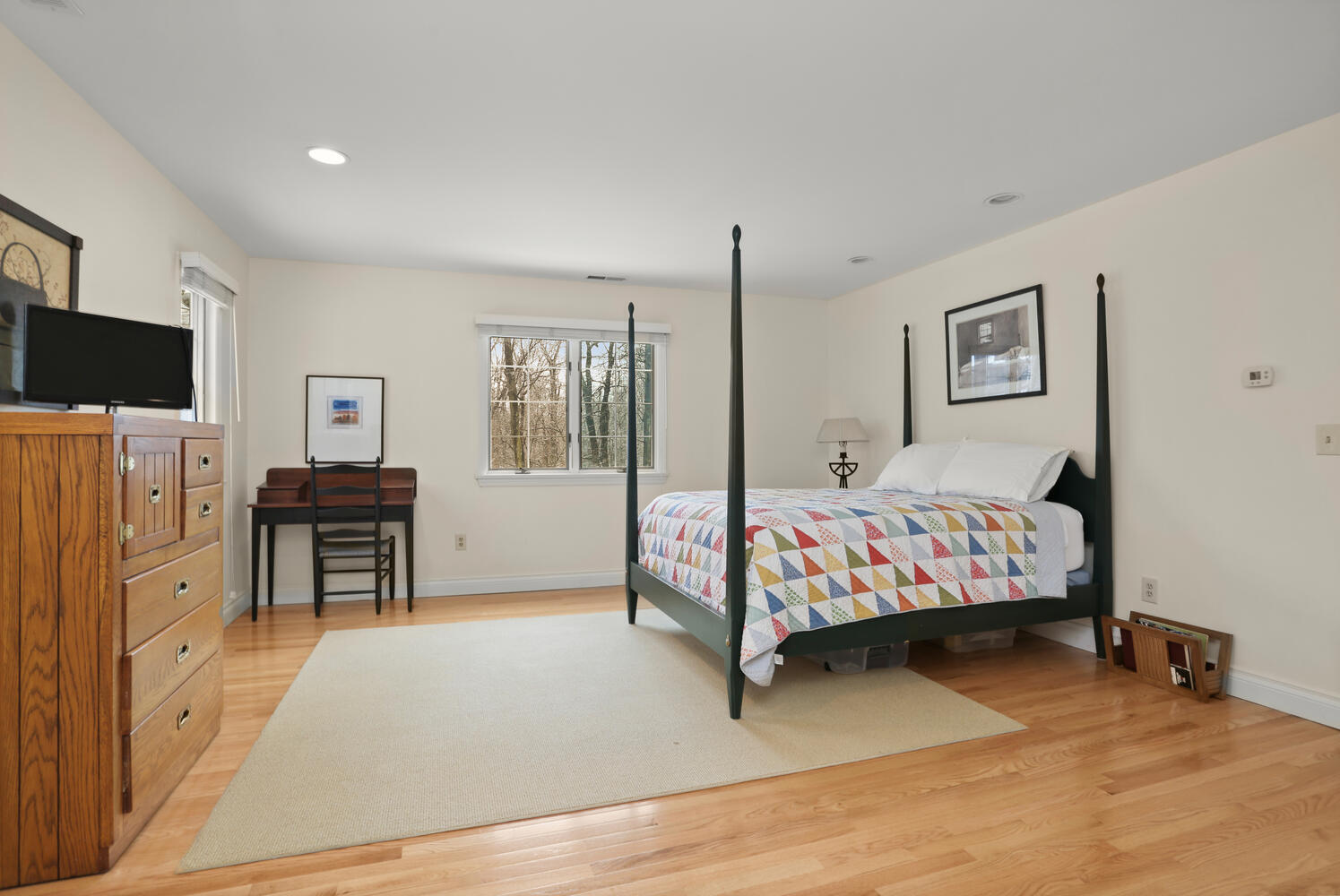 215 Marvin Ridge Road New Canaan, CT 06840 - Photo 23 of 31 a bedroom with furniture and a flat screen tv