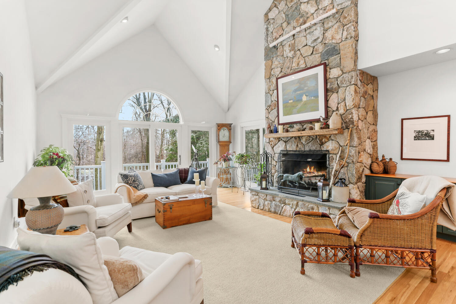 215 Marvin Ridge Road New Canaan, CT 06840 - Photo 3 of 31 a living room with furniture a fireplace and a chandelier