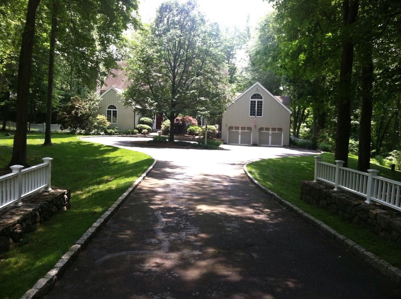 215 Marvin Ridge Road New Canaan, CT 06840 - Photo 31 of 31 a front view of a house with garden
