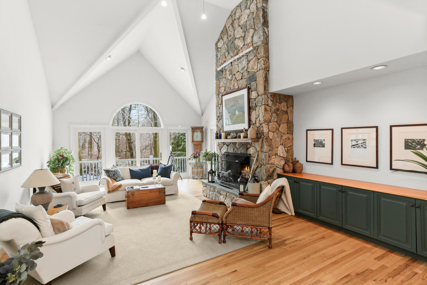 215 Marvin Ridge Road New Canaan, CT 06840 - Photo 4 of 31 a living room with furniture a fireplace and a large window