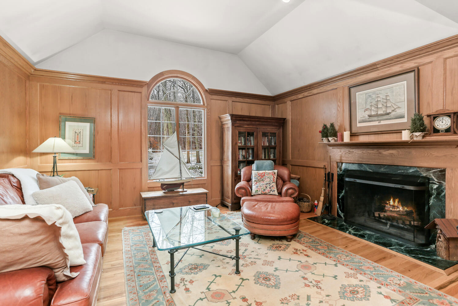215 Marvin Ridge Road New Canaan, CT 06840 - Photo 6 of 31 a living room with furniture a rug and a fireplace