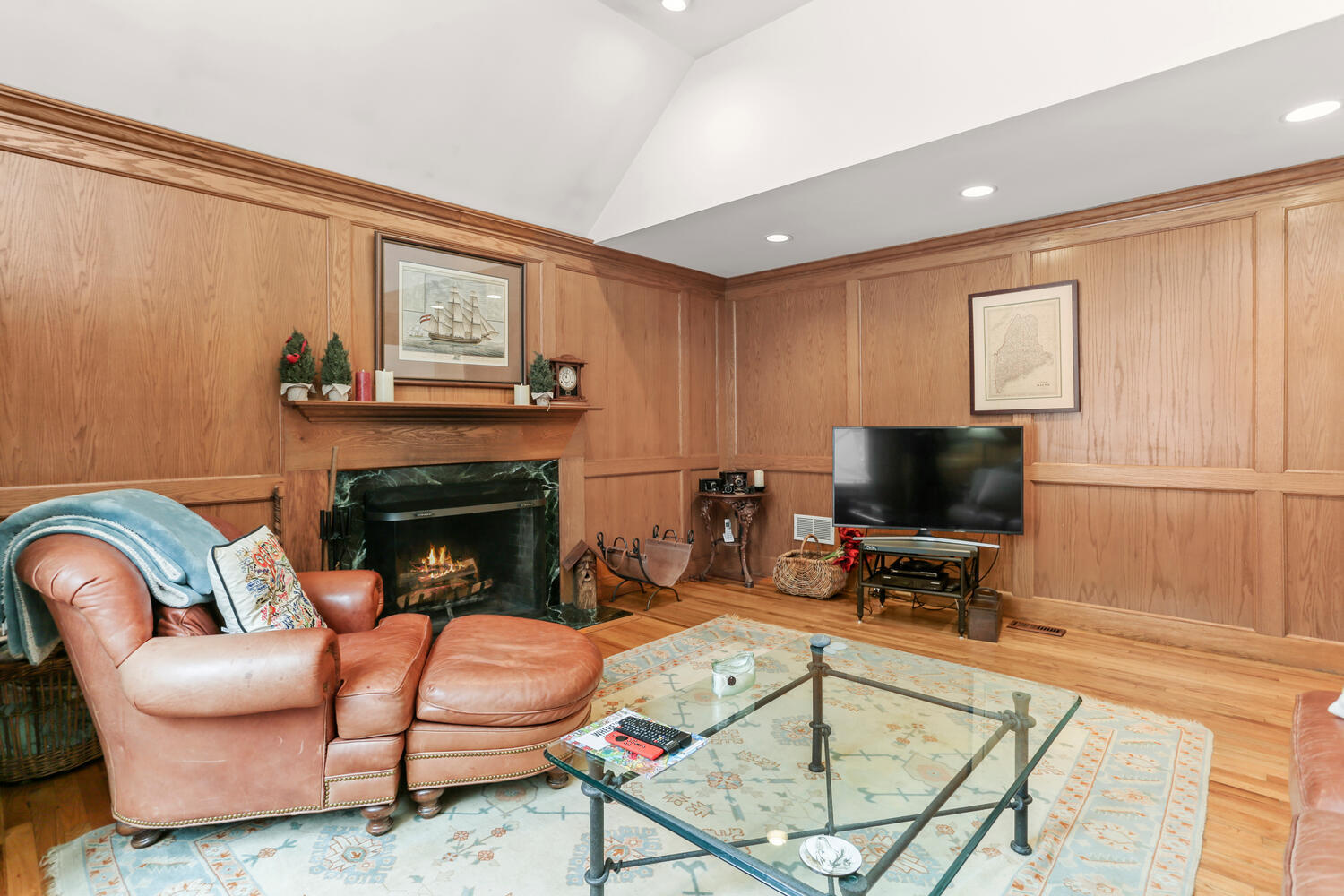 215 Marvin Ridge Road New Canaan, CT 06840 - Photo 7 of 31 a living room with furniture a flat screen tv and a fireplace