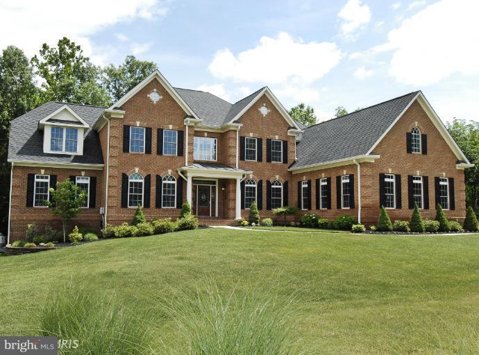 22526 Evergreen Mills Road Ashburn, VA 20148 - Photo 1 of 30 a front view of a house with a yard
