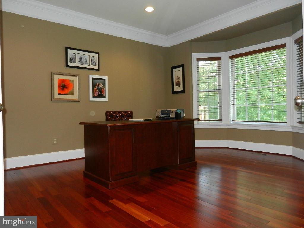 22526 Evergreen Mills Road Ashburn, VA 20148 - Photo 14 of 30 a living room with wooden floor and large window