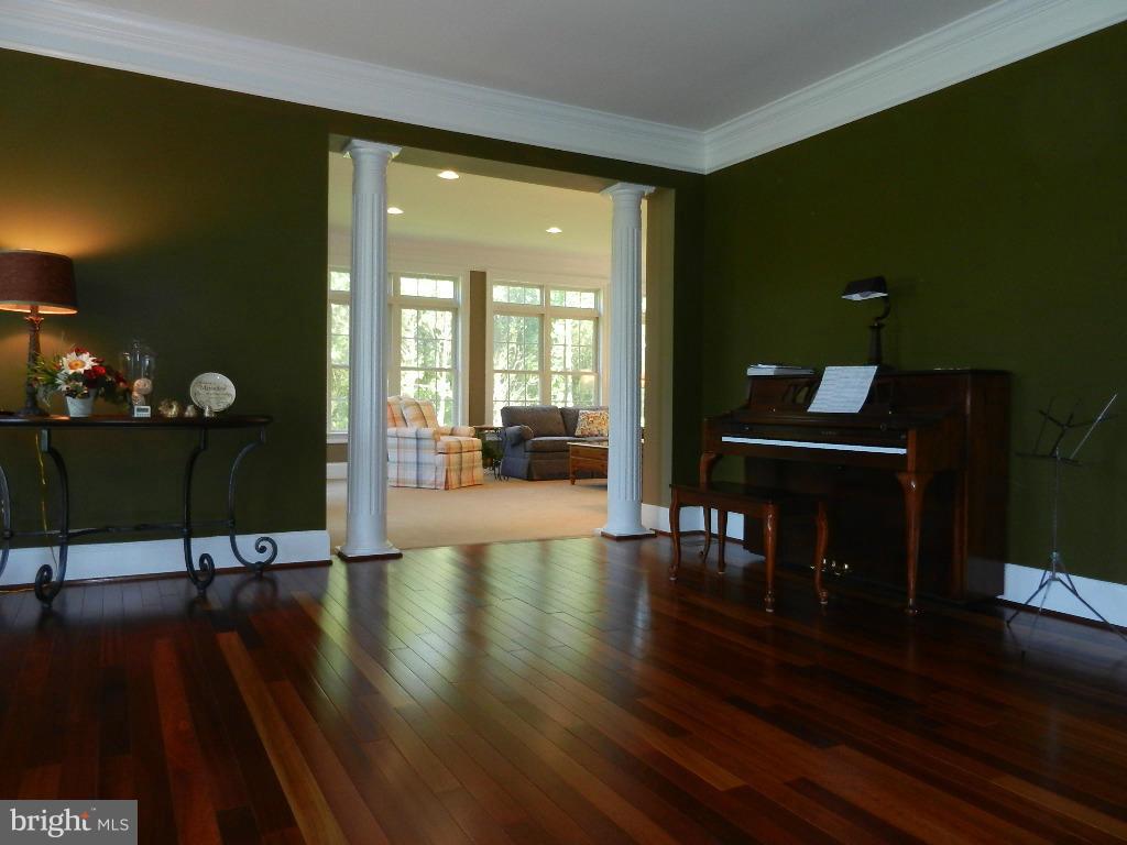 22526 Evergreen Mills Road Ashburn, VA 20148 - Photo 15 of 30 a living room with furniture and a wooden floor
