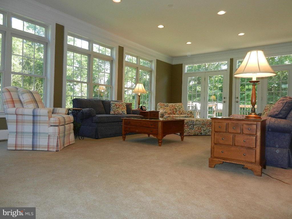 22526 Evergreen Mills Road Ashburn, VA 20148 - Photo 16 of 30 a living room with furniture and a large window