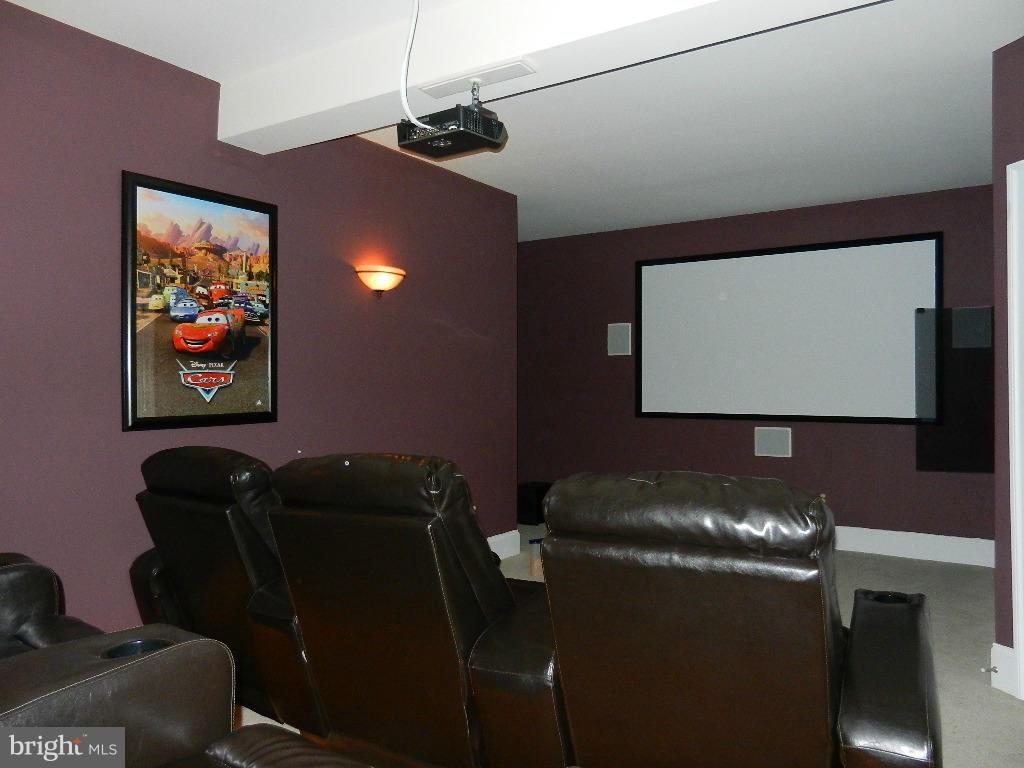 22526 Evergreen Mills Road Ashburn, VA 20148 - Photo 23 of 30 a room with furniture projector and screen