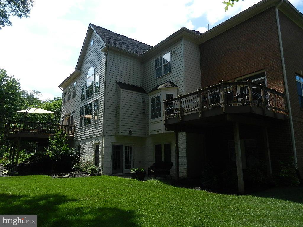 22526 Evergreen Mills Road Ashburn, VA 20148 - Photo 27 of 30 a front view of house with yard