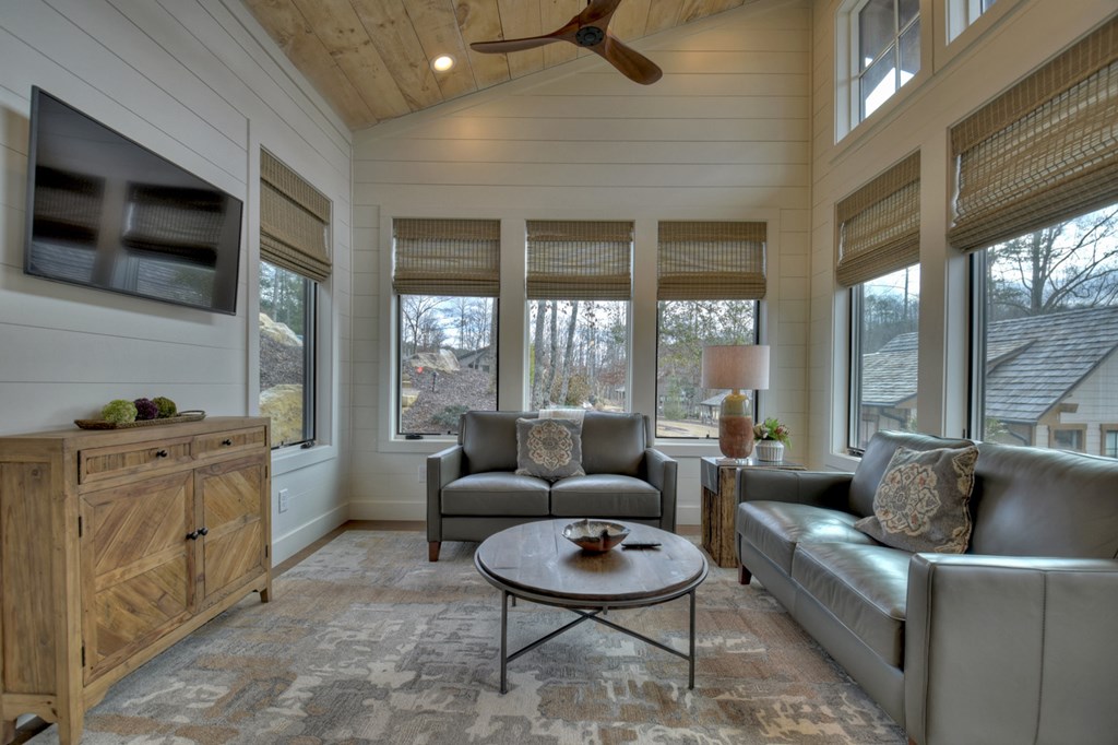 Hc9 Old Toccoa Loop Mineral Bluff, GA 30559 - Photo 15 of 41 a living room with furniture a flat screen tv and a floor to ceiling window