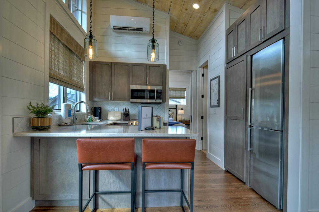 Hc9 Old Toccoa Loop Mineral Bluff, GA 30559 - Photo 16 of 41 a kitchen with stainless steel appliances granite countertop a dining table chairs refrigerator and cabinets