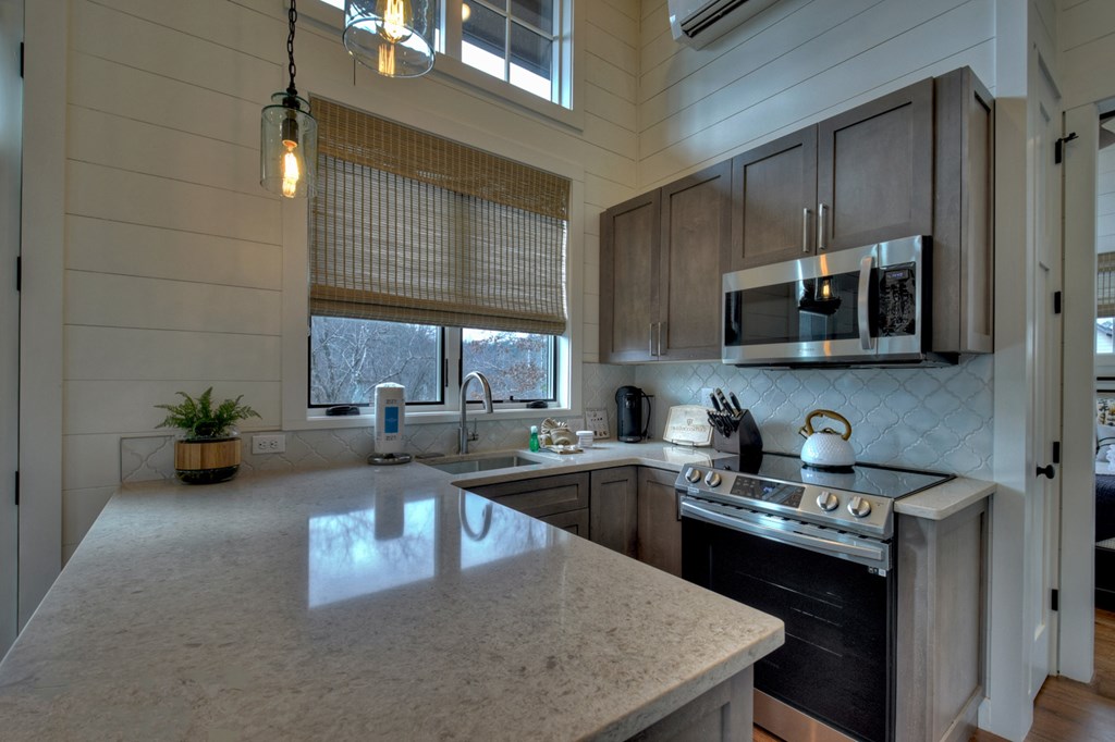 Hc9 Old Toccoa Loop Mineral Bluff, GA 30559 - Photo 18 of 41 a kitchen with a sink a counter top space cabinets and stainless steel appliances