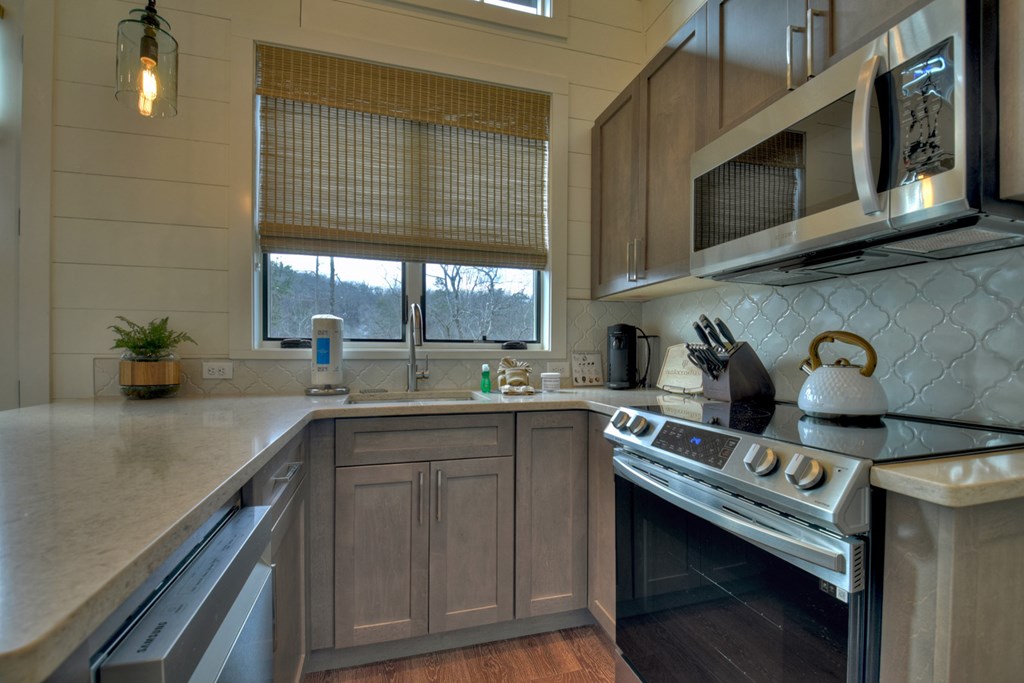 Hc9 Old Toccoa Loop Mineral Bluff, GA 30559 - Photo 19 of 41 a kitchen with stainless steel appliances granite countertop a sink stove and cabinets