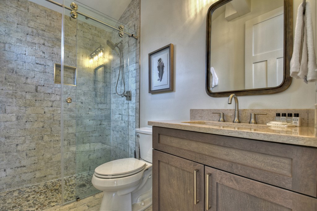 Hc9 Old Toccoa Loop Mineral Bluff, GA 30559 - Photo 27 of 41 a bathroom with a granite countertop toilet sink and mirror