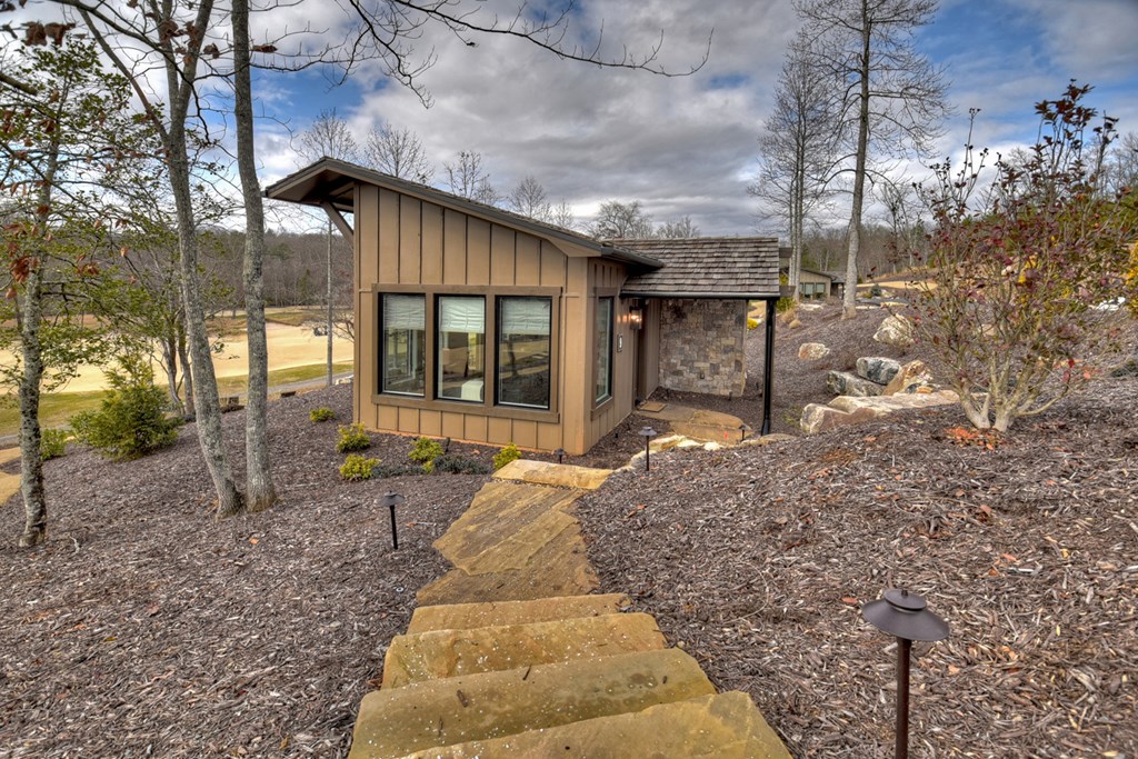 Hc9 Old Toccoa Loop Mineral Bluff, GA 30559 - Photo 4 of 41 a front view of a house with a garden