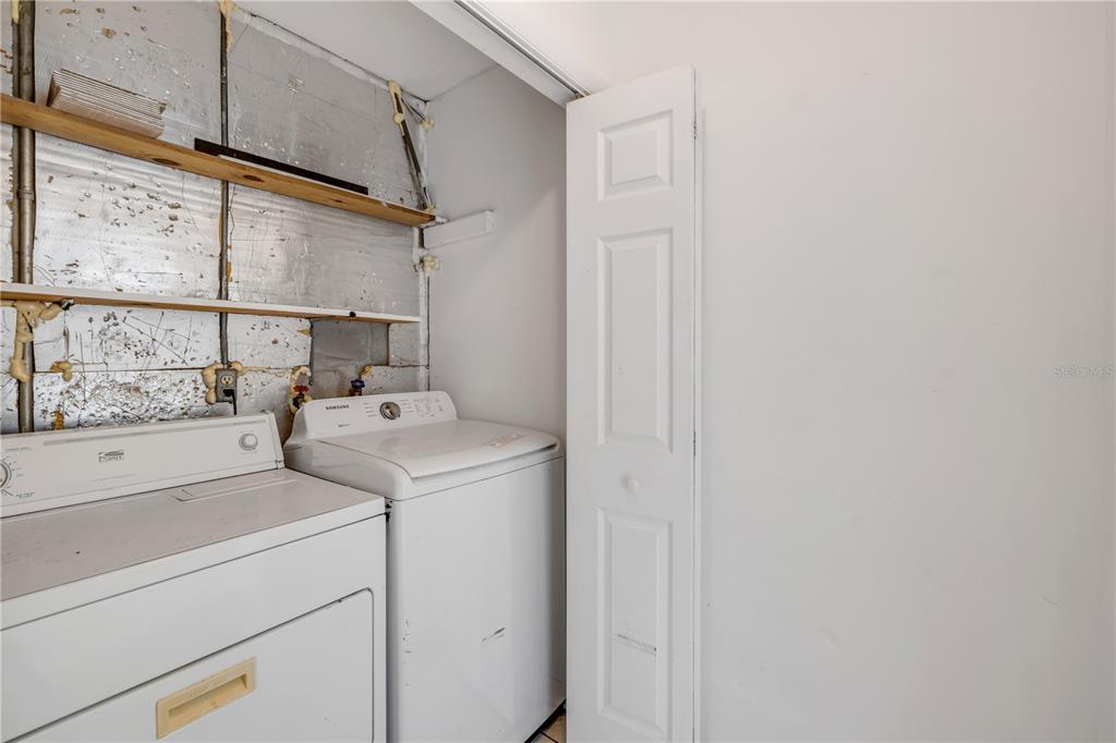 3132 Pine Tree Drive Edgewater, FL 32141 - Photo 17 of 32 a utility room with dryer and washer