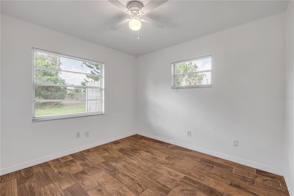 3132 Pine Tree Drive Edgewater, FL 32141 - Photo 23 of 32 an empty room with a window