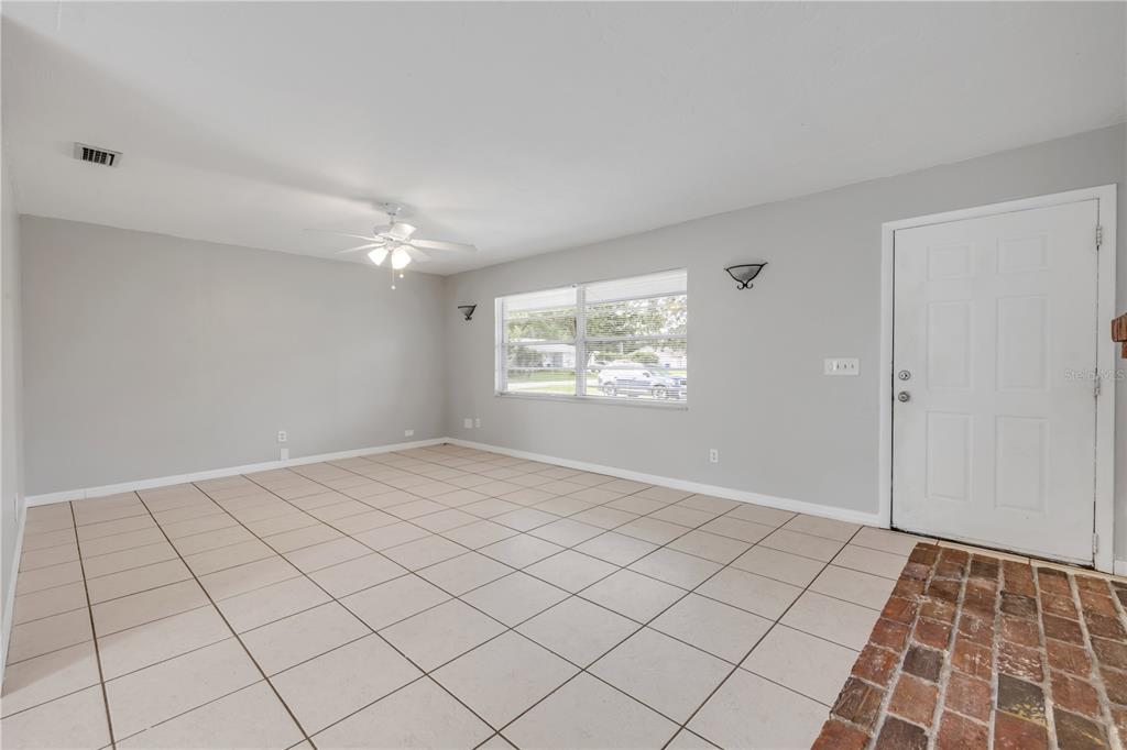 3132 Pine Tree Drive Edgewater, FL 32141 - Photo 6 of 32 a view of an empty room and window