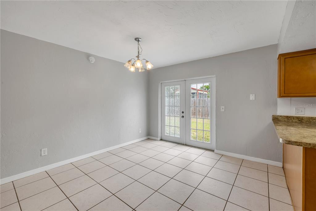 3132 Pine Tree Drive Edgewater, FL 32141 - Photo 9 of 32 a view of an empty room and window