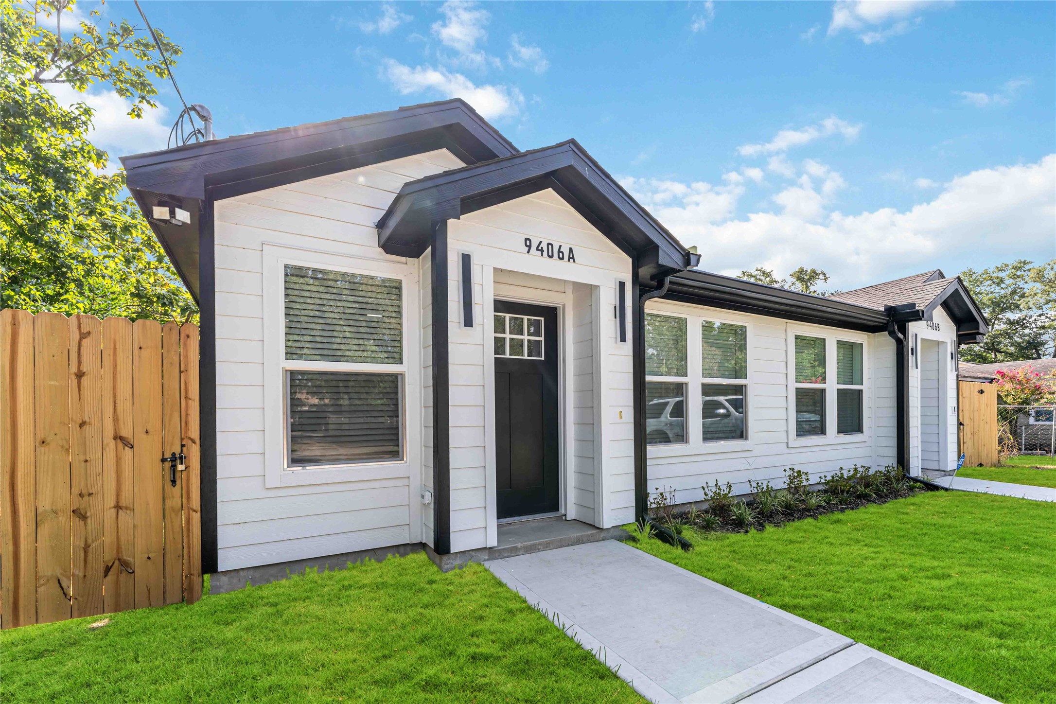 9406 Sandra Street, Unit A Houston, TX 77016 - Photo 2 of 28 front view of a house with a yard