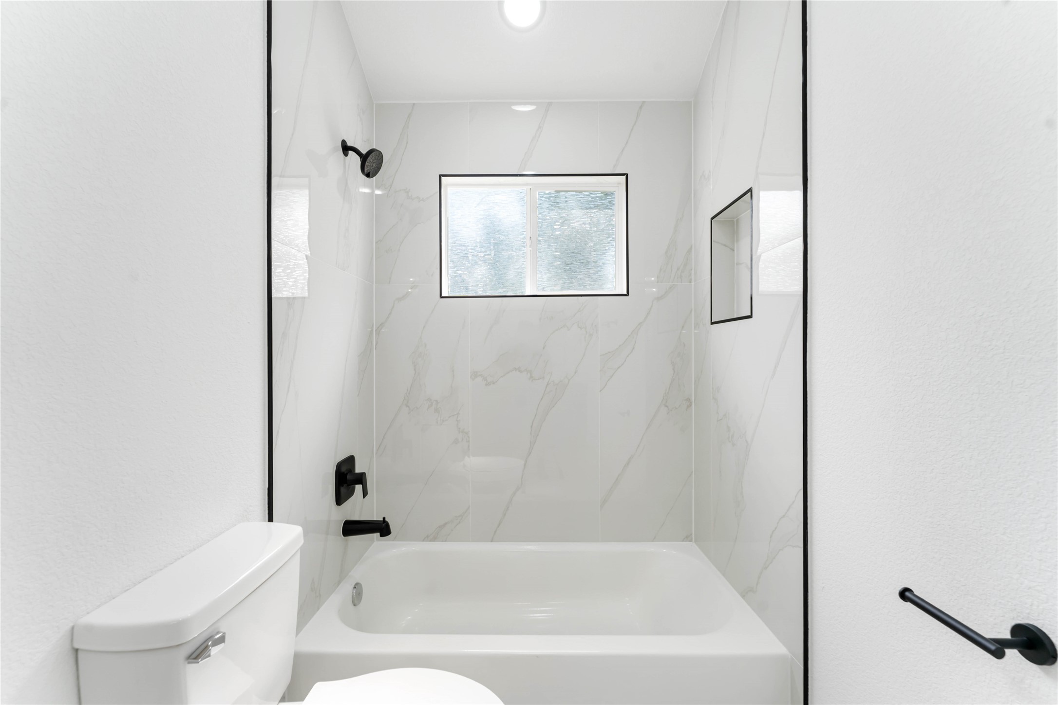 9406 Sandra Street, Unit A Houston, TX 77016 - Photo 24 of 28 a bathroom with a bathtub and a toilet