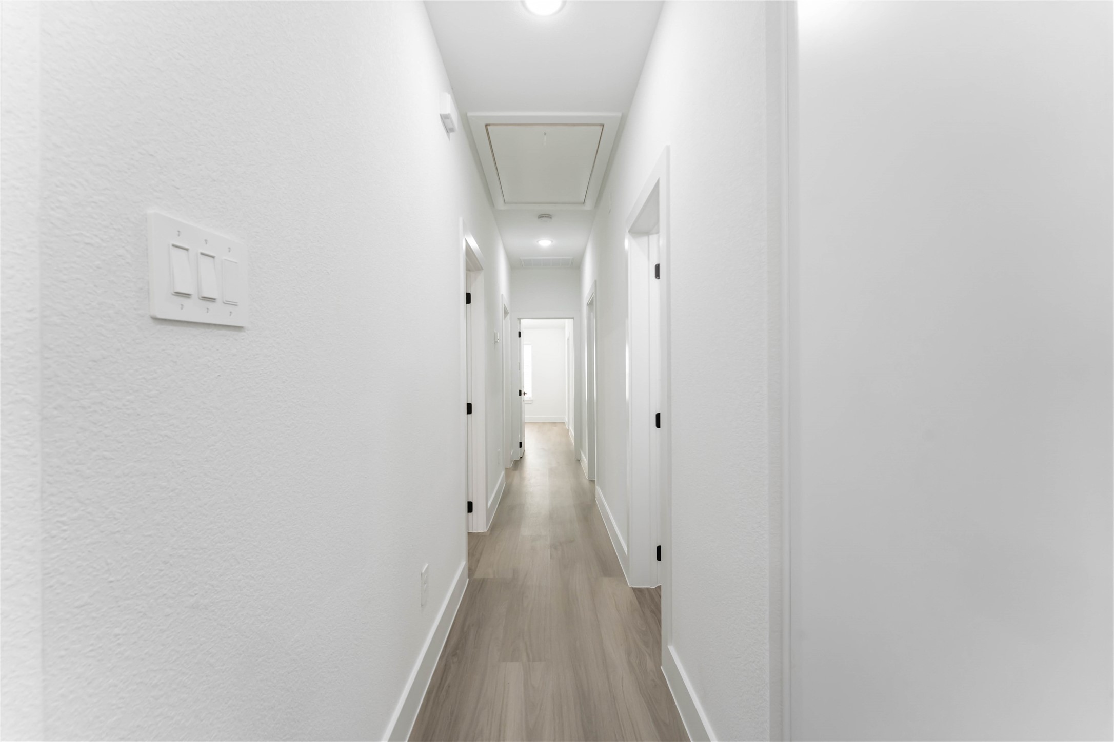 9406 Sandra Street, Unit A Houston, TX 77016 - Photo 26 of 28 a view of a hallway with wooden floor