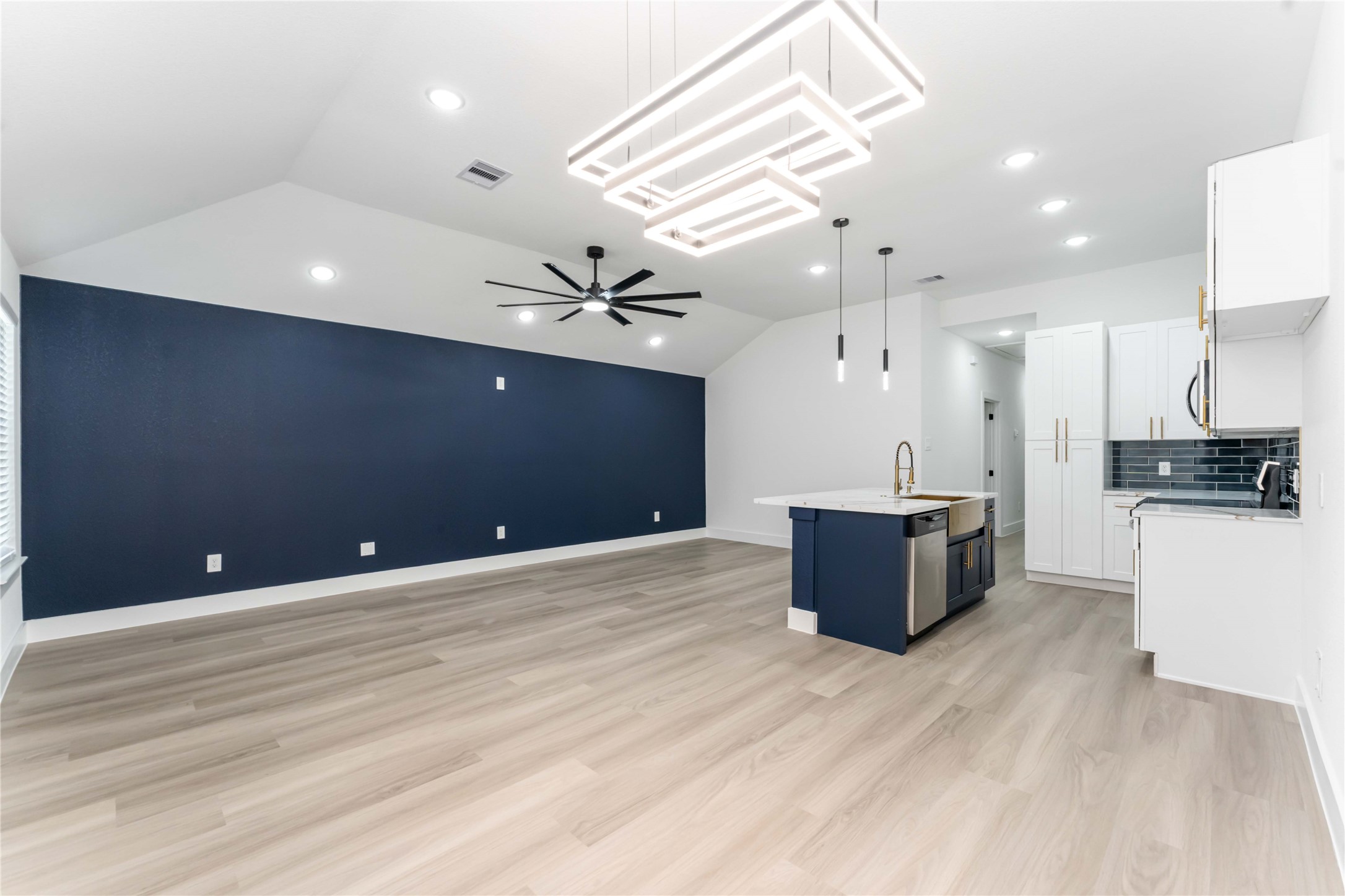 9406 Sandra Street, Unit A Houston, TX 77016 - Photo 5 of 28 a large room with stainless steel appliances kitchen island a large island in the center