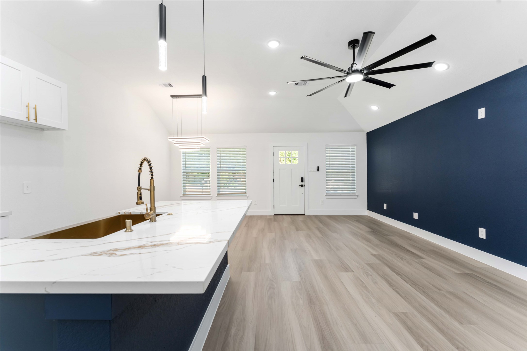 9406 Sandra Street, Unit A Houston, TX 77016 - Photo 8 of 28 a kitchen with a sink and a refrigerator