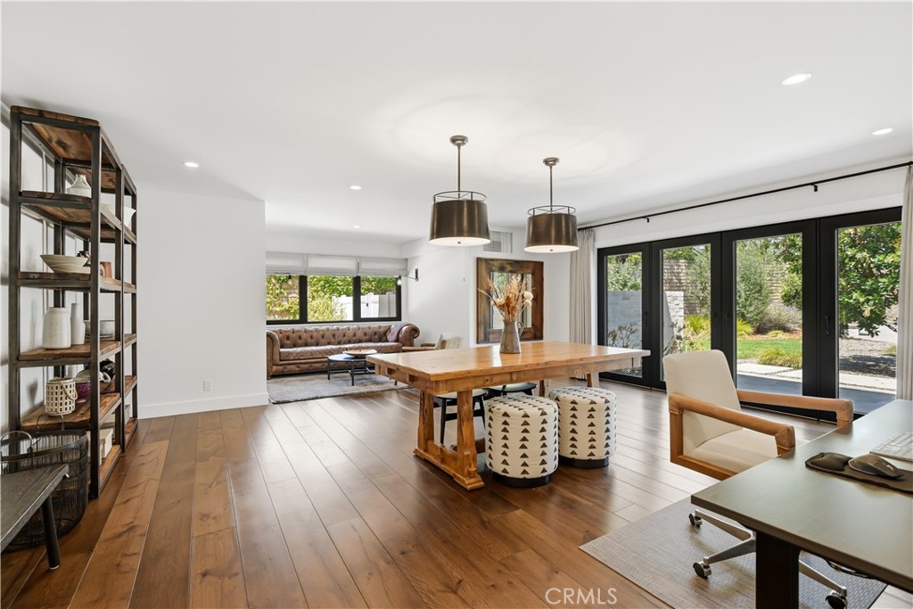 24884 Jim Bridger Road Hidden Hills, CA 91302 - Photo 13 of 31 a living room with furniture and a wooden floor