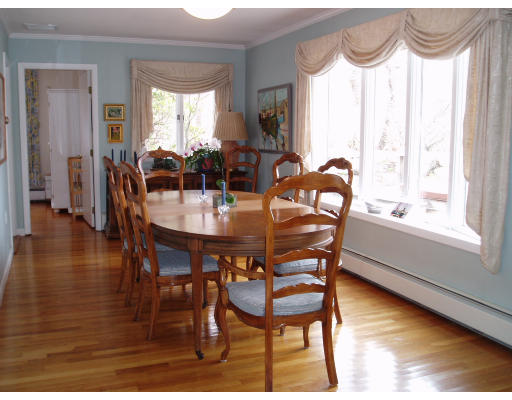 12 Links Road Gloucester, MA 01930 - Photo 5 of 10 a view of a dining room with furniture window and wooden floor