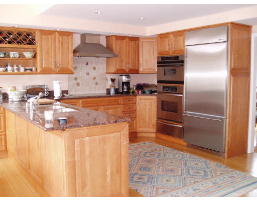 12 Links Road Gloucester, MA 01930 - Photo 7 of 10 a kitchen with stainless steel appliances granite countertop a refrigerator a stove and a sink